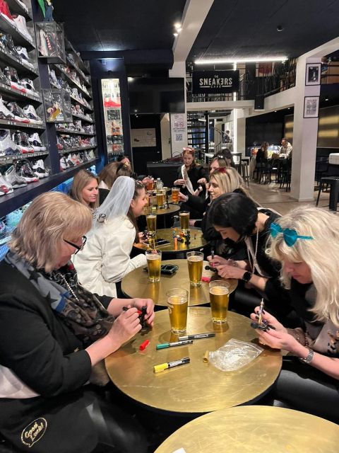 Brussels Tipsy Tour: Cocktail Making, Painting & Chocolates - Painting a tiny Manneken Pis statue