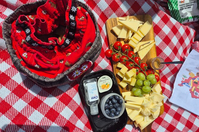 Cheese and chocolate on mountain summit - Five cheeses, cold cuts, bread, and jam