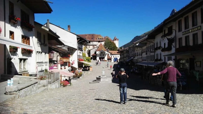 From Geneva: Gruyères Tour with Cheese & Chocolate Factories - Lunch and your first look at Gruyères