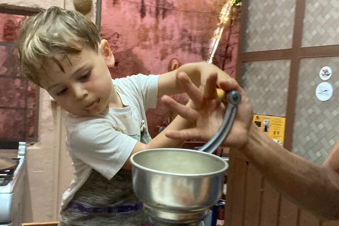Make Your Own Chocolate with Oaxacan Tradition Private Class - Roasting cacao on a San Marcos Tlapazola comal