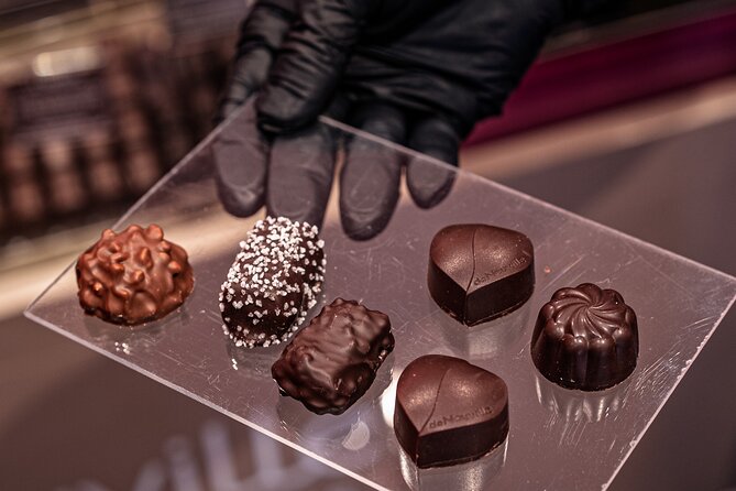 Paris Small-Group Montmartre Chocolate & Pastry Walking Tour - Eclairs and neighborhood life at Place des Abbesses