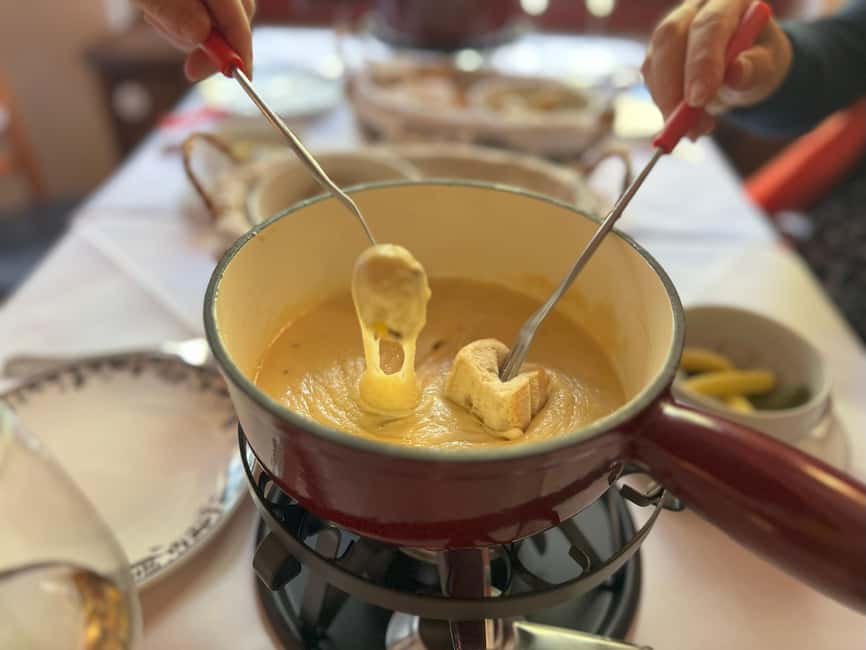 Zurich: Food Tour of 8+ Tastings with Cheeses & Chocolates - Fondue with Kirsch and a little Swiss theater